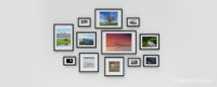 A number of black picture frames with white mounts of different sizes and aspect ratios all displaying different landscape and travel photographs and hanging on a white wall. Used to illustrate the SmartFrame article: Common aspect ratios in photography and video